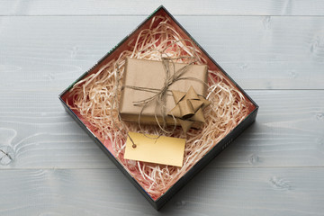 Decoration of gift box wrapped in craft paper