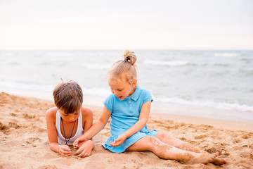 two children playing on beach