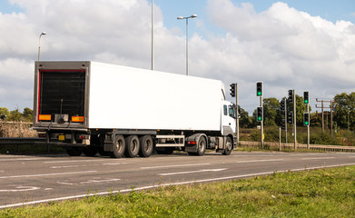 White lorry awaiting on the traffic lights