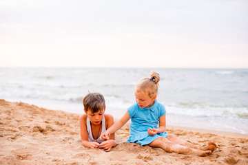 two children playing on beach