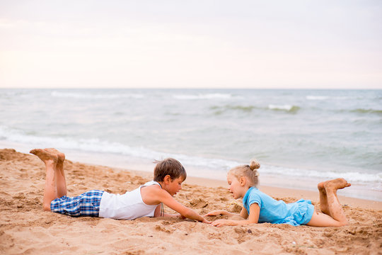 two children playing on beach