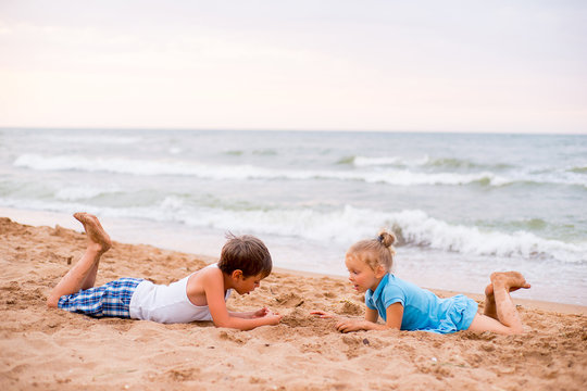 two children playing on beach