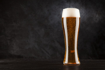 Beer glass on dark background