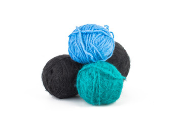 Several multi-colored balls, knitting yarn. On white, isolated background.