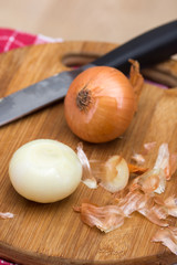 Onions on the wooden cutting board