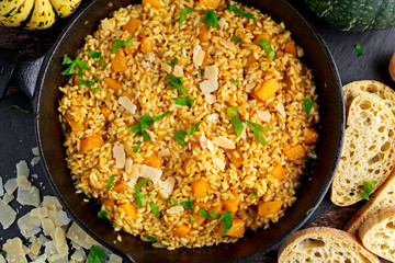 Pumpkin risotto in iron pan with Parmesan cheese, bread