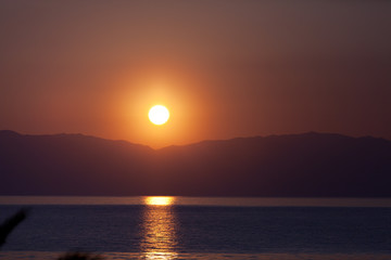 Beautiful sunset in Corfu over the sea.