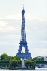 Eiffel tower and the Statue of liberty at dusk