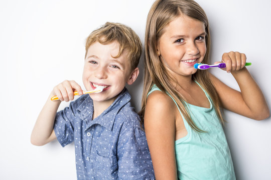 Cute Little Child Brushing Teeth, Isolated On White