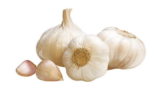 Three heads of garlic on a white background