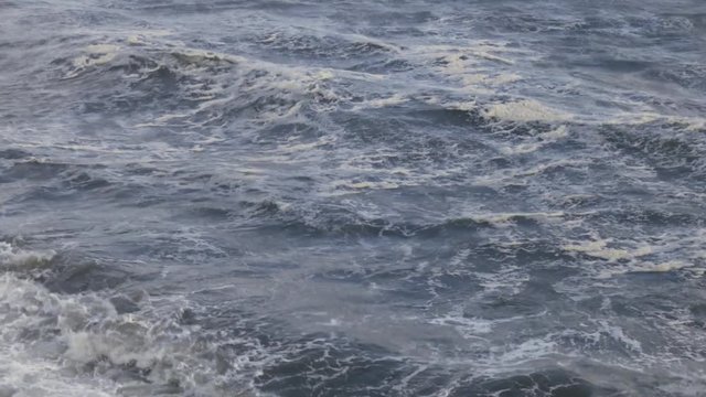 Breaking waves / Foamy sea waves during storm