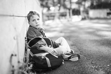 student boy outside at school standing