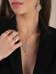 Pink gold jewelry on human model