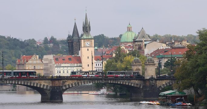 Red trams on Legion Bridge in Prague
