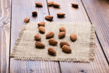 The nuts on a wooden background