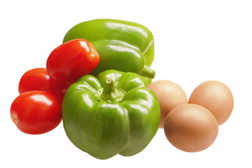 Two sweet bell peppers with tomatoes and eggs. Ingredients for cooking