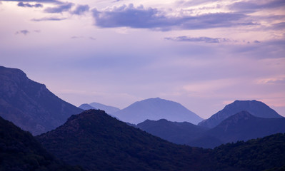 Fototapeta na wymiar Layered mountains at sunrise. Beautiful nature landscape