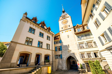 Obraz premium View on the city gate and clock tower in Zug town near Zurich city in Switzerland
