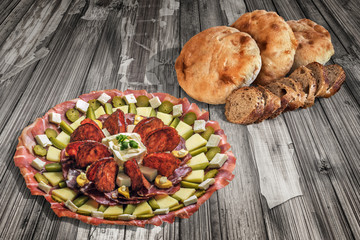 Appetizer Dish Meze With Pita Bread And Integral Baguette Slices On Old Cracked Wooden Surface