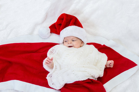 Cute newborn Christmas baby in Santa  hat