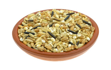 Blend of rice and grains in a bowl isolated on a white background
