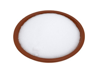 Table salt in a bowl on a white background.