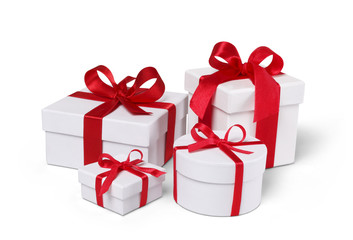 White gift boxes with red ribbon isolated with clipping path