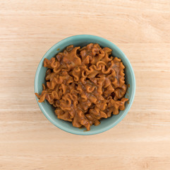 Marinara pasta in a bowl on table top view.