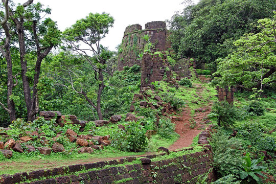 Ruins of turret and other structures of Cabo de Rama Fort in Goa, India. A centuries old fort, last owned by the Portuguese during their occupation of Goa.