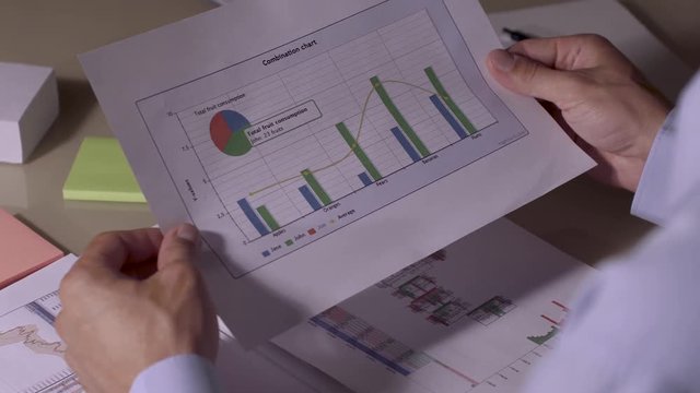 Man finishing his work on checking the documents