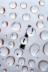Exclamation mark behind water drops. Abstract background