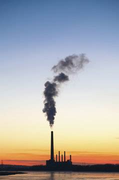 Smoke pouring from power plant smoke stack, Minnesota, USA