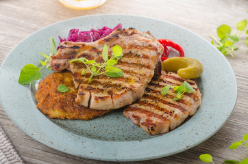 Grilled pork chops with herbs and garlic, potato pancakes