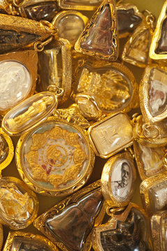 Gold Buddhist Amulets; Prachuap Kiri Khan, Prachuap Province, Thailand