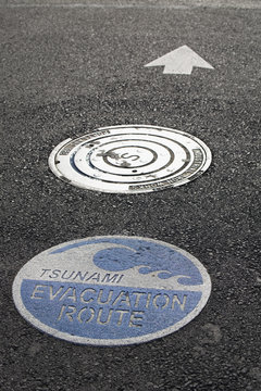 Tsunami Warning Signs On The Road With Arrow For Direction; Lincoln City, Oregon, United States of America