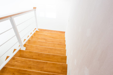 The modern wooden stair way in home close up.(Processed in vintage colour tone)