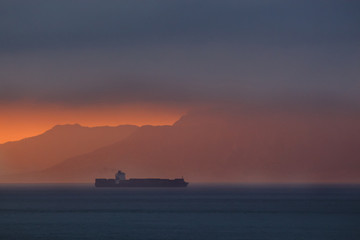 Cargo ship passing through straits of Gilbraltar, Tarifa, Cadiz, Andalusia, Spain