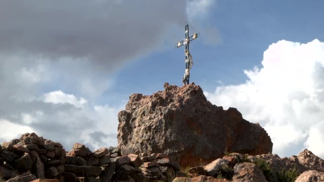 Decorative cross on a boulder in Juliaca, Peru.