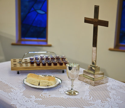 Communion Emblems Set Up On A Table With A Cross; Sheffield, South Yorkshire, England