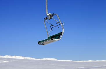Chair-lift in ski resort at sun day