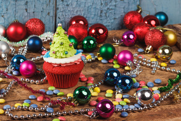 Fototapeta premium Cupcakes with old wooden background