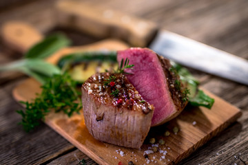 Grilled beef steak  on wooden cutting board
