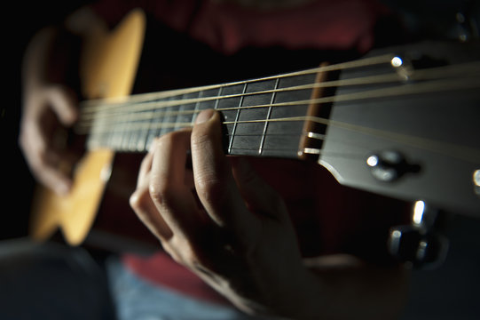Playing A Guitar; Edmonton, Alberta, Canada