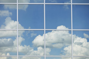 A Blue Sky With Clouds Through A Window; Edmonton, Alberta, Canada