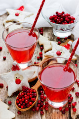 Cranberry juice or drink and funny cookies shape santa