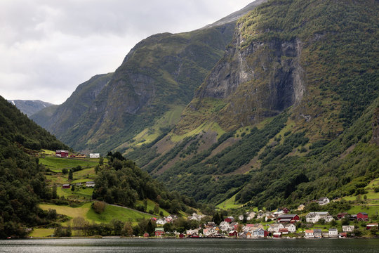 Houses In A Valley Along The Water's Edge; Undredal, Sogn Og Fjordane, Norway