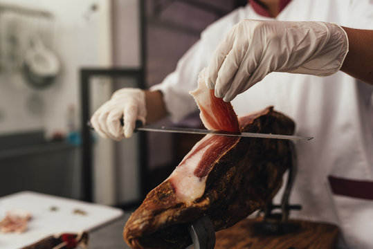 Pretty Butchery Woman Cutting Ham.