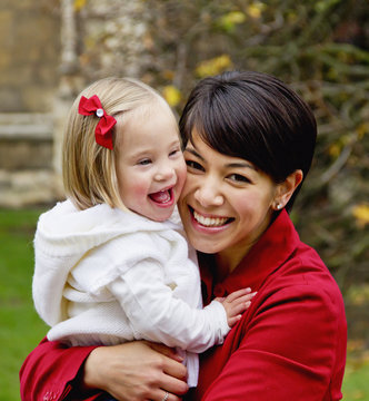Portrait Of A Mother And Daughter Laughing; Cambridge, England