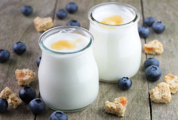 White yougurt in glass bowls.