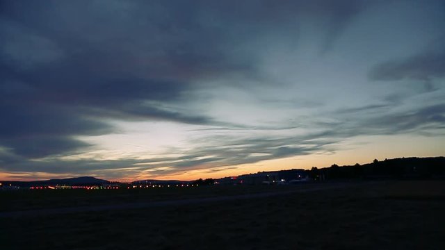 Airplane landing at Airport at sunset in Switzerland